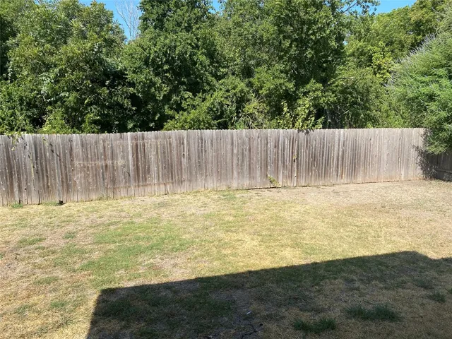 a view of a kitchen from the hallway