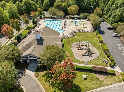 an aerial view of a house with a swimming pool