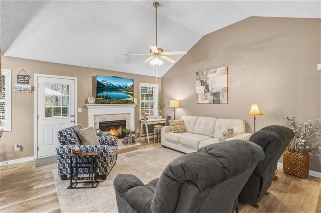 60 Sugar Birch Way Dallas, GA 30132 - Photo 2 of 31 a living room with furniture a fireplace and a flat screen tv