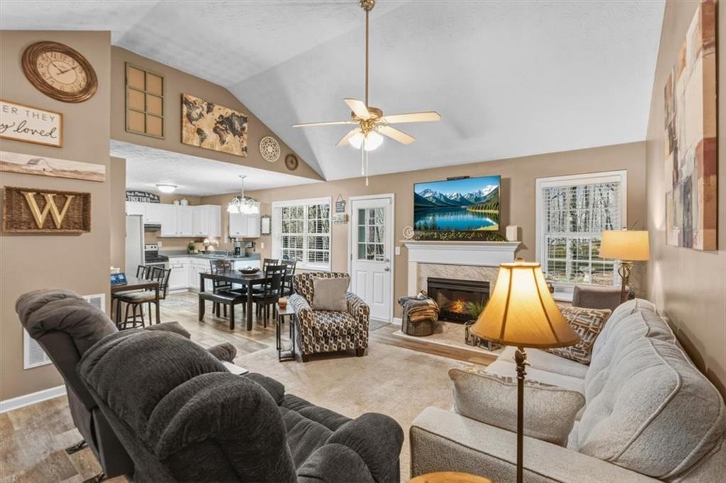 60 Sugar Birch Way Dallas, GA 30132 - Photo 3 of 31 a living room with furniture a fireplace and a flat screen tv