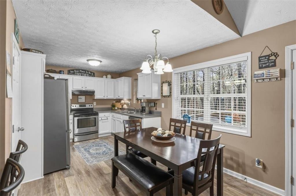 60 Sugar Birch Way Dallas, GA 30132 - Photo 7 of 31 a view of a dining room with furniture window and wooden floor