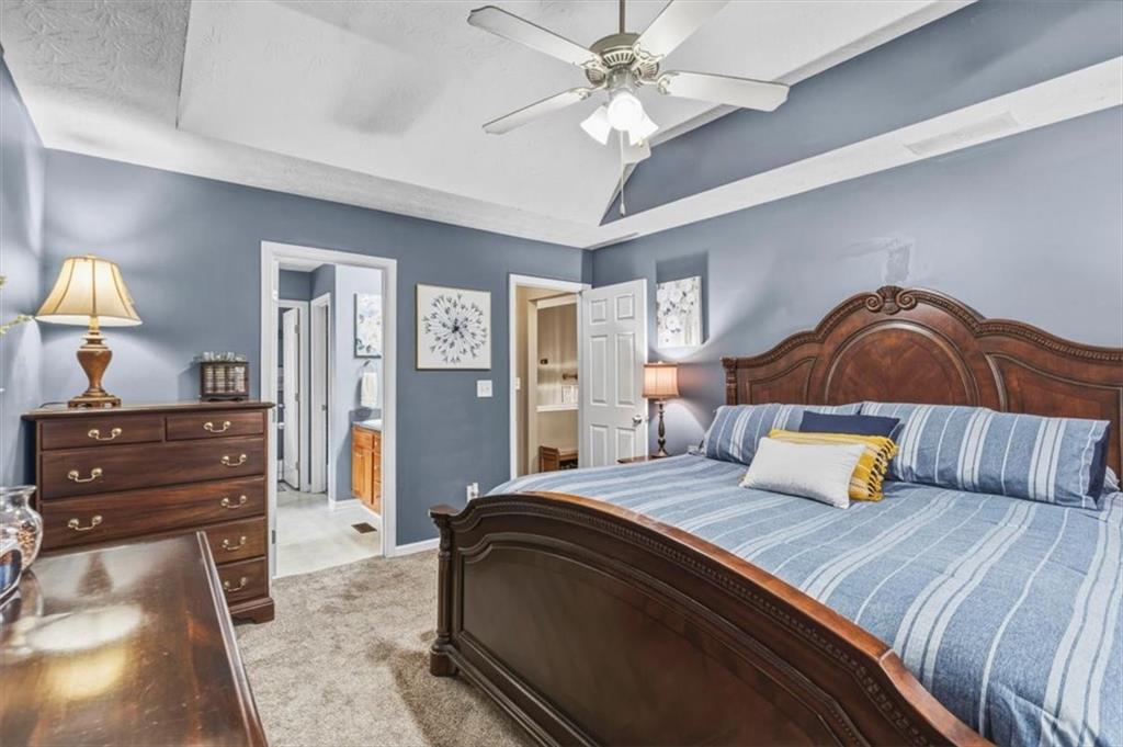 60 Sugar Birch Way Dallas, GA 30132 - Photo 9 of 31 a bedroom with a bed and wooden floor