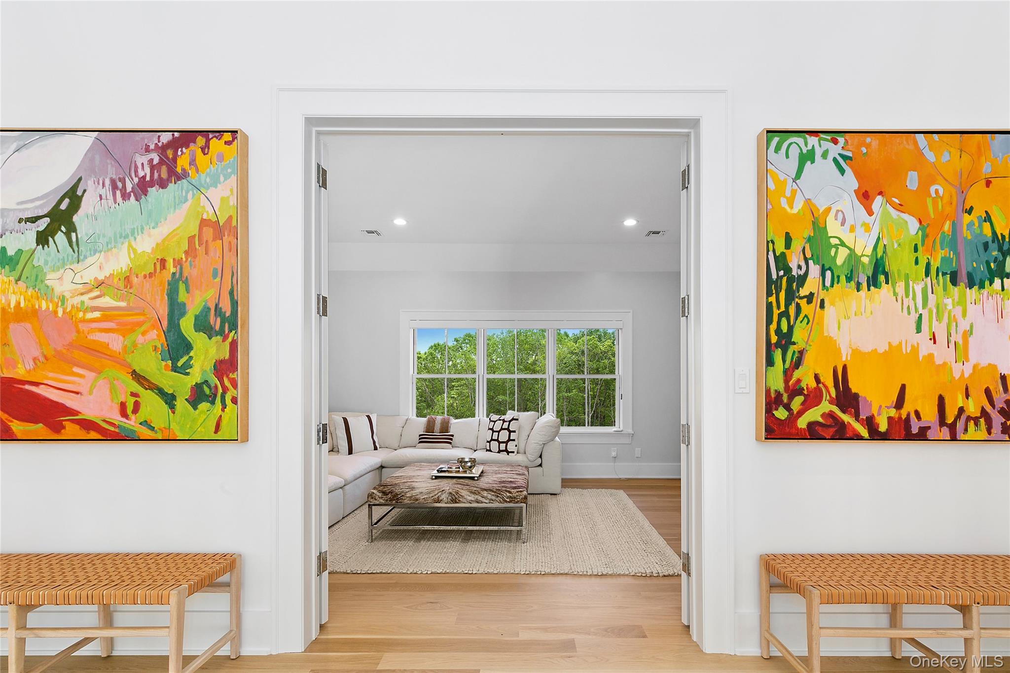 94 Merchants Path Sagaponack, NY 11962 - Photo 11 of 15 a living room with furniture and a painting on the wall