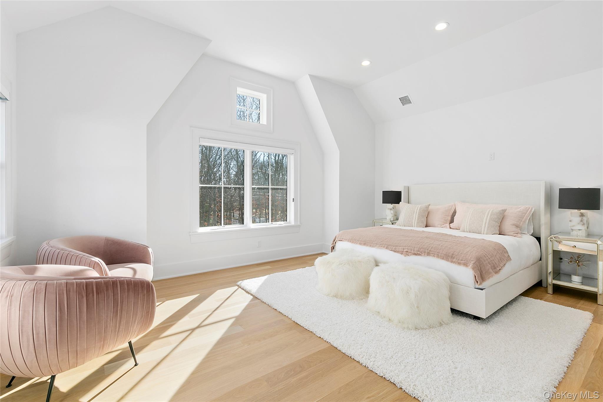 94 Merchants Path Sagaponack, NY 11962 - Photo 14 of 15 a spacious bedroom with a bed and wooden floor