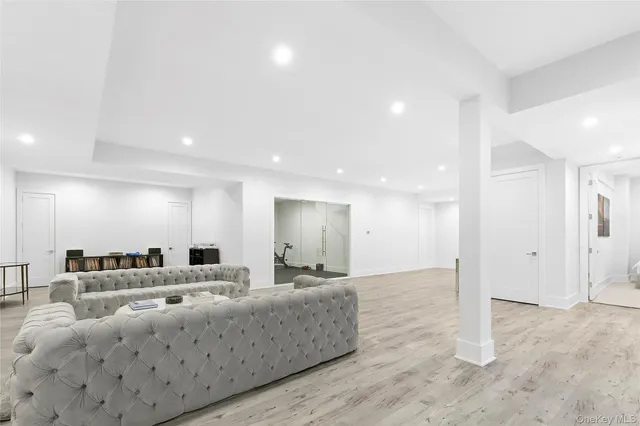 a large room with a lot of white furniture