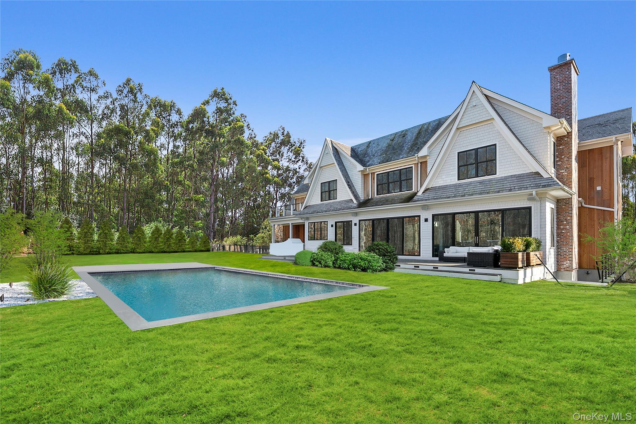 94 Merchants Path Sagaponack, NY 11962 - Photo 2 of 15 front view of a house with a yard