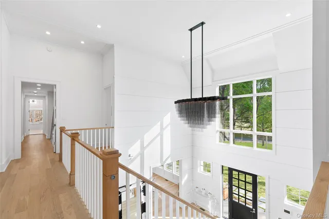 a view of an entryway with wooden floor