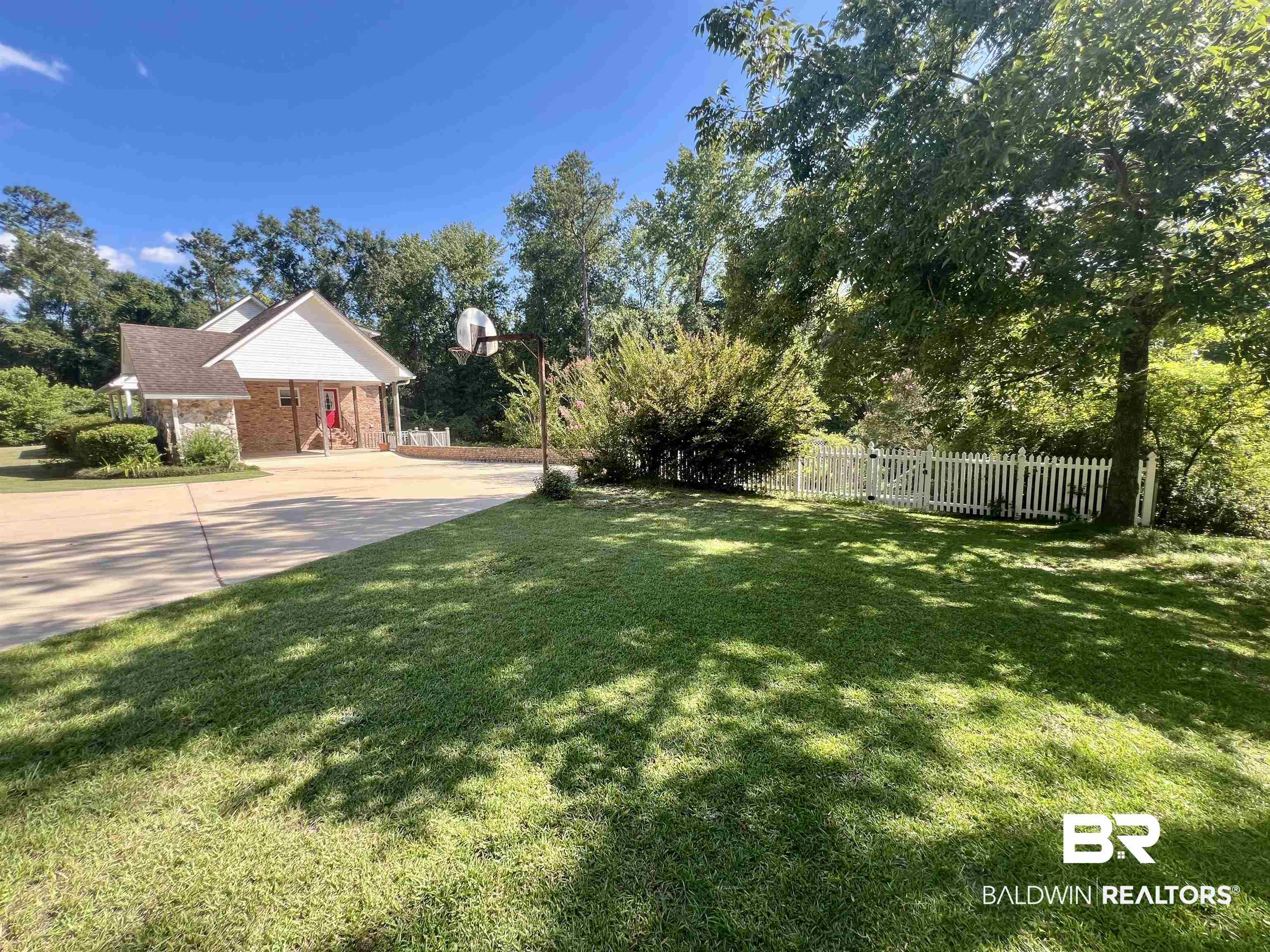 2691 Appleton Road Brewton, AL 36426 - Photo 58 of 60 View of yard with basketball court and view of scattered trees