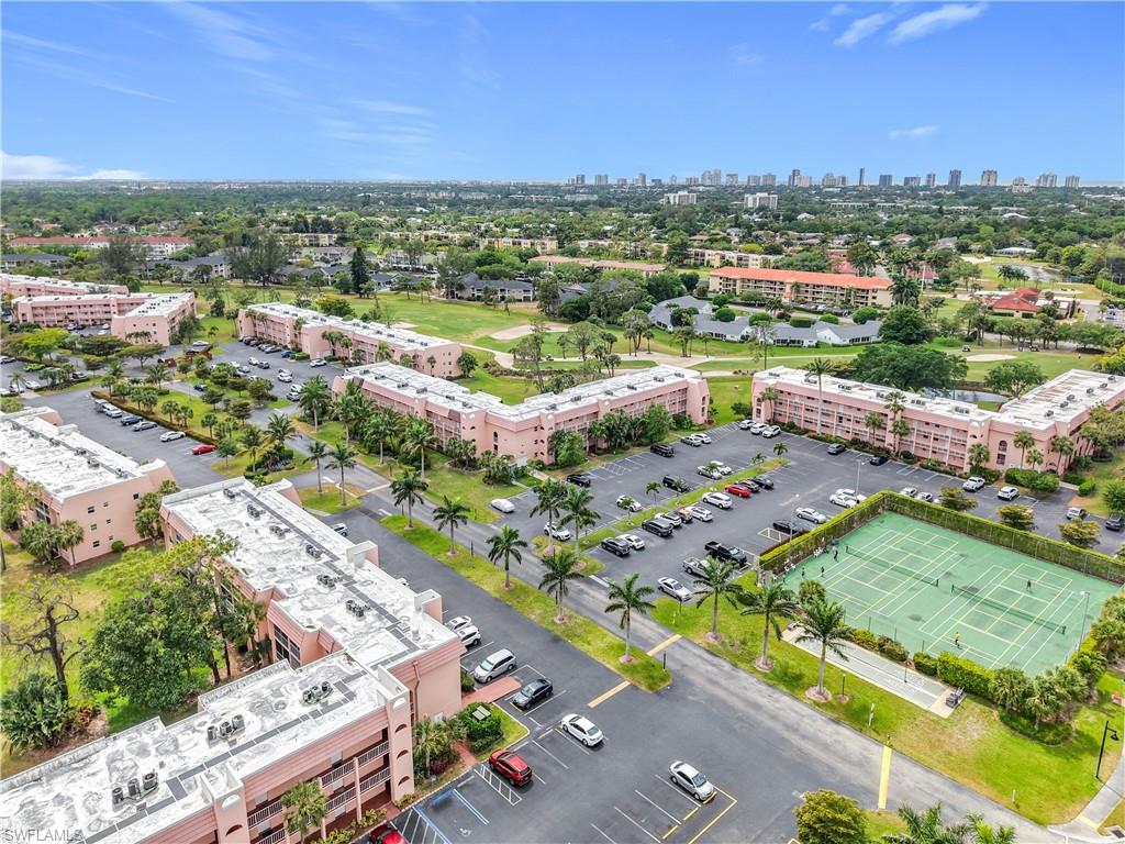150 Turtle Lake Court, Unit 309 Naples, FL 34105 - Photo 3 of 42 Aerial view of a view of skyline and apartment complex