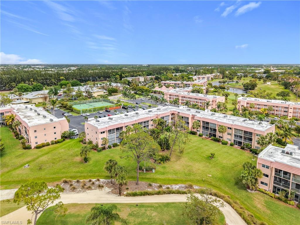 150 Turtle Lake Court, Unit 309 Naples, FL 34105 - Photo 38 of 42 Bird's eye view of apartment complex and a nearby body of water