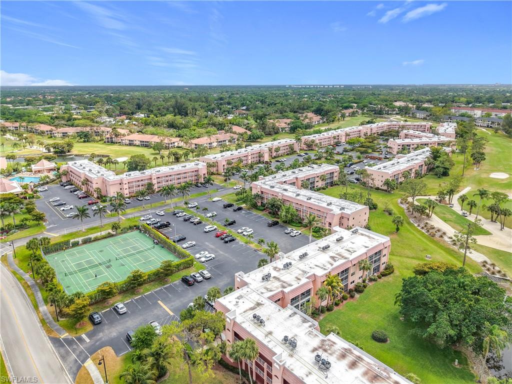 150 Turtle Lake Court, Unit 309 Naples, FL 34105 - Photo 5 of 42 Bird's eye view of apartment complex / building and a golf course