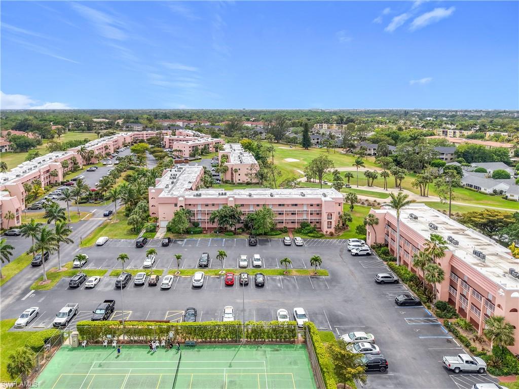 150 Turtle Lake Court, Unit 309 Naples, FL 34105 - Photo 6 of 42 Bird's eye view of apartment complex / building and a golf club
