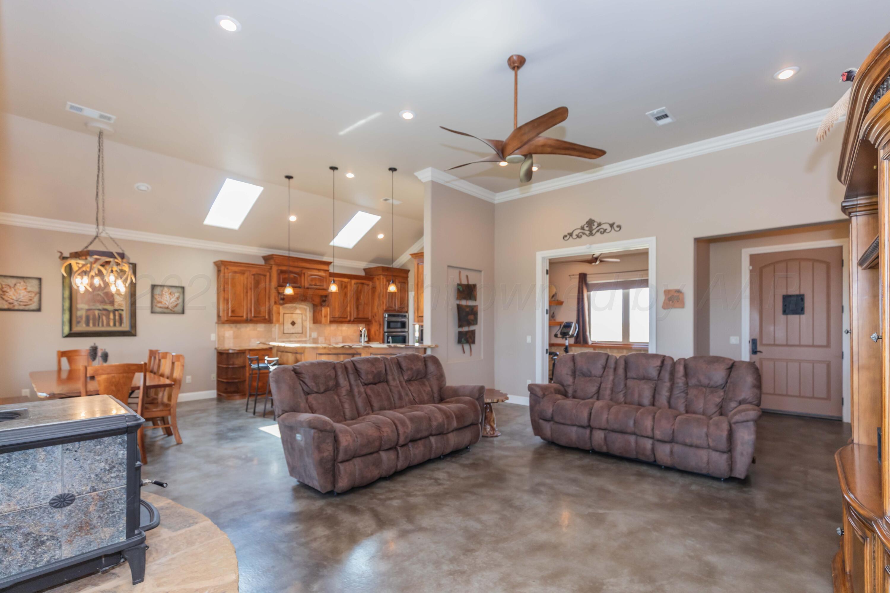11400 Busan Way Canyon, TX 79015 - Photo 12 of 107 a living room with furniture and a ceiling fan