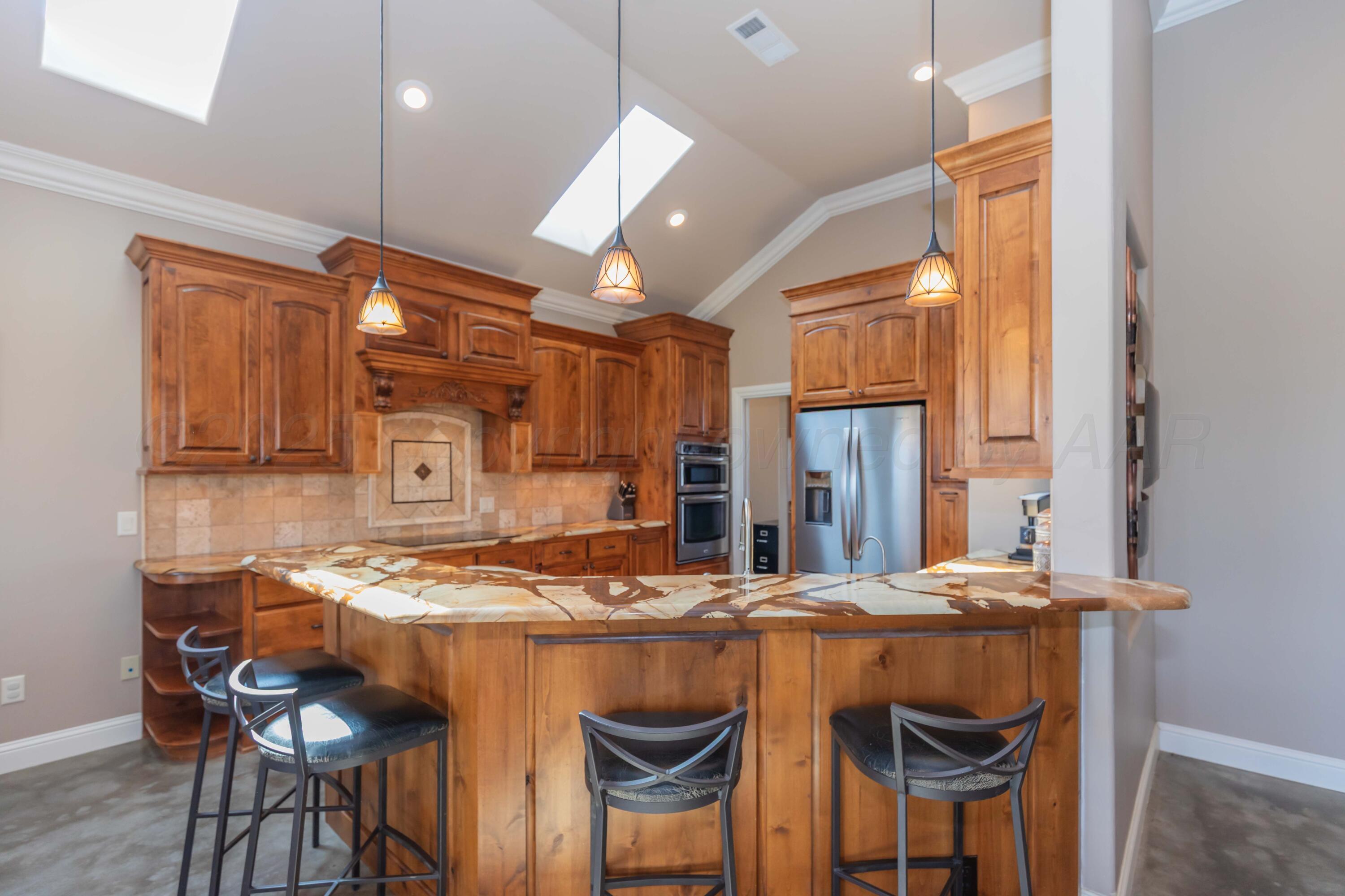 11400 Busan Way Canyon, TX 79015 - Photo 19 of 107 a dining table chairs refrigerator and cabinets