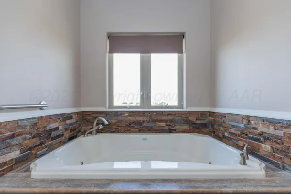 a house view with swimming pool