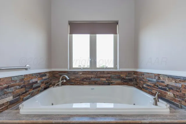 a house view with swimming pool