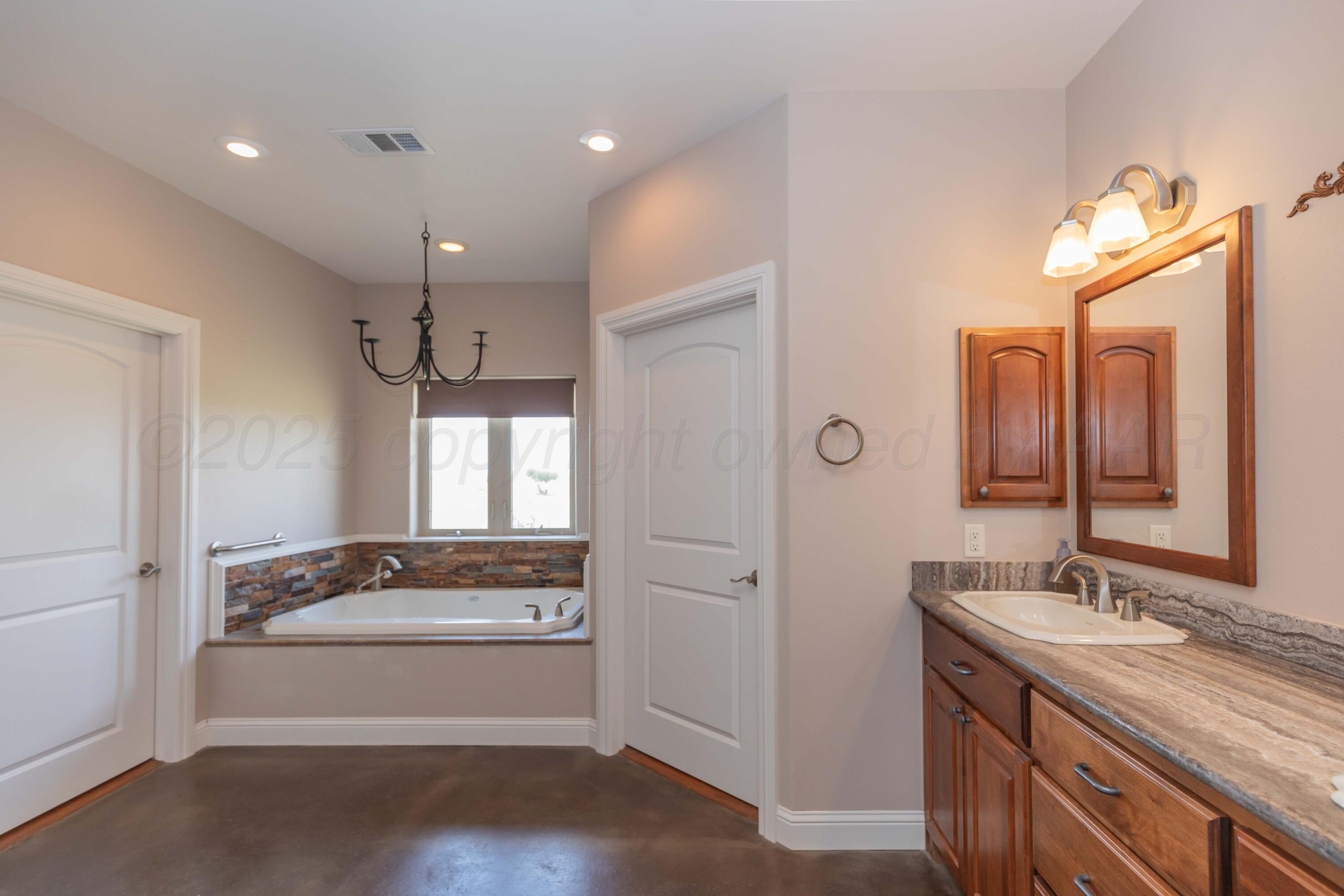 11400 Busan Way Canyon, TX 79015 - Photo 34 of 107 a bathroom with a sink and a mirror