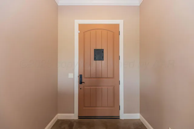 a dining table chairs refrigerator and cabinets