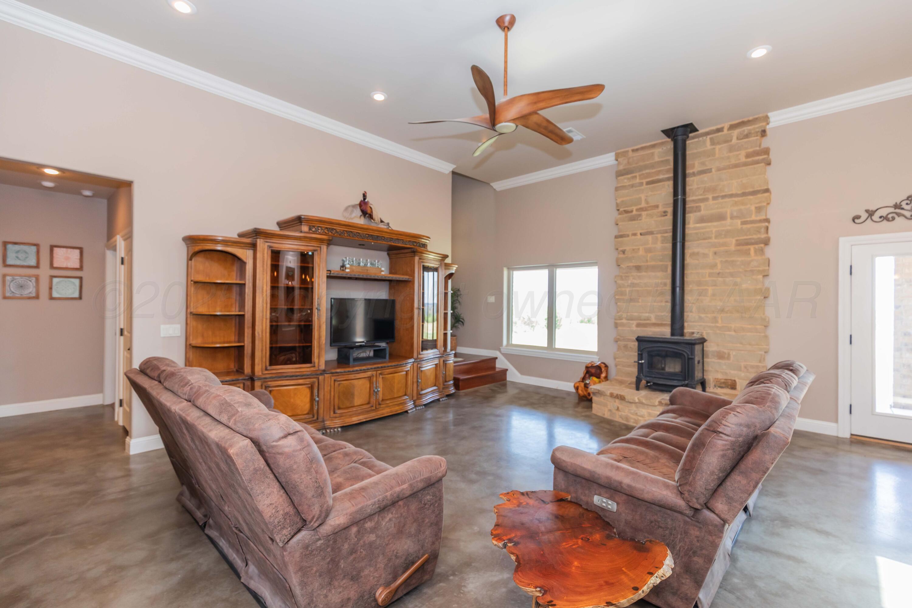 11400 Busan Way Canyon, TX 79015 - Photo 10 of 107 a living room with furniture ceiling fan and a large window