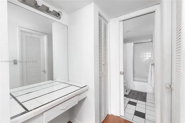 a bathroom with a tub and a shower