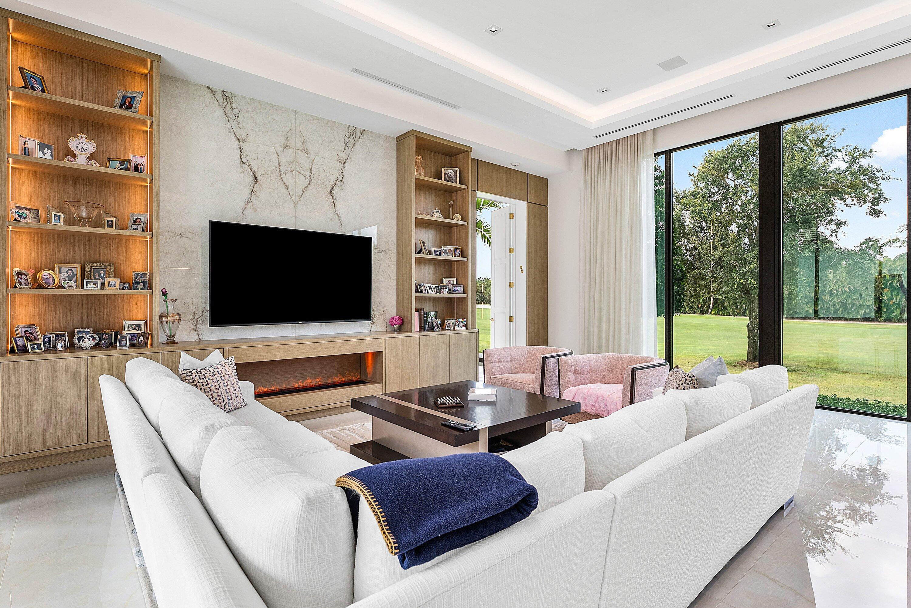 17615 Foxborough Lane Boca Raton, FL 33496 - Photo 25 of 120 a living room with fireplace furniture and a flat screen tv