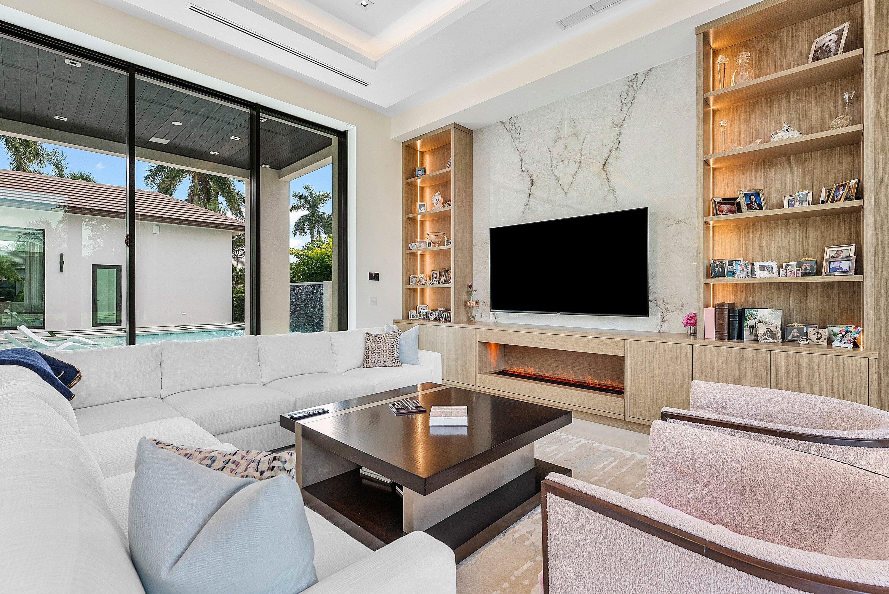 17615 Foxborough Lane Boca Raton, FL 33496 - Photo 26 of 120 a living room with furniture and a flat screen tv