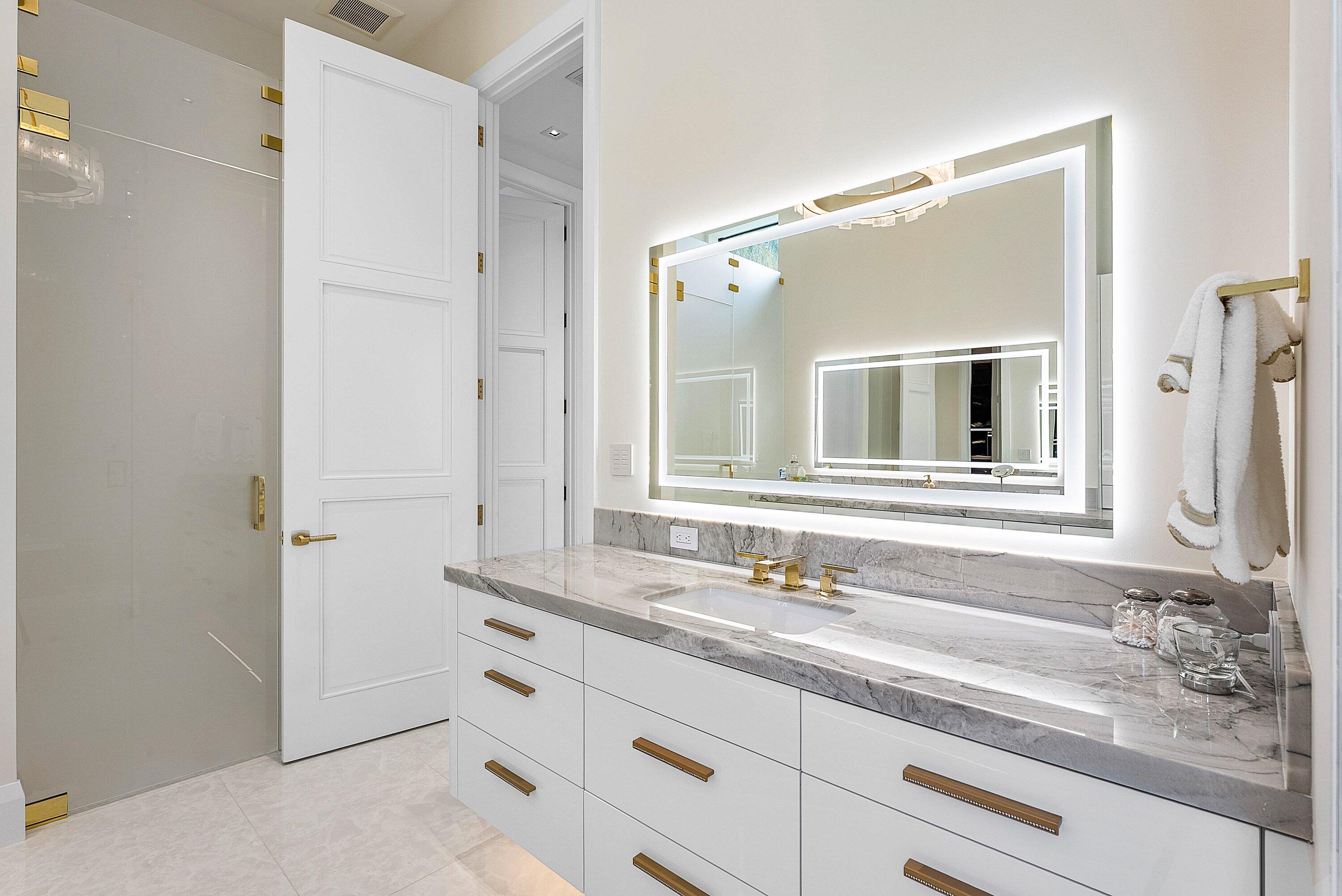 17615 Foxborough Lane Boca Raton, FL 33496 - Photo 34 of 120 a bathroom with a sink and a mirror