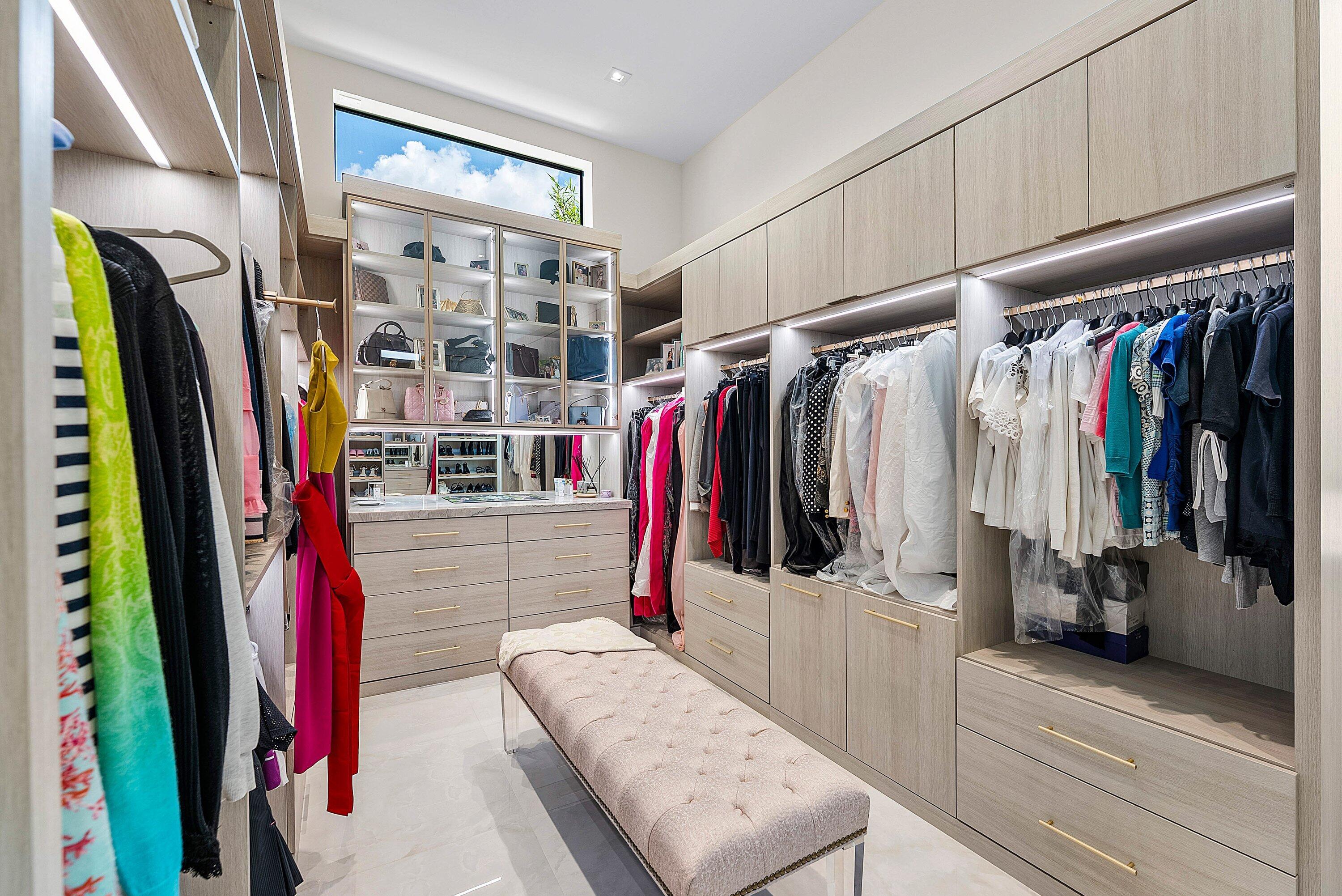 17615 Foxborough Lane Boca Raton, FL 33496 - Photo 36 of 120 a view of walk in closet with clothes and shoes