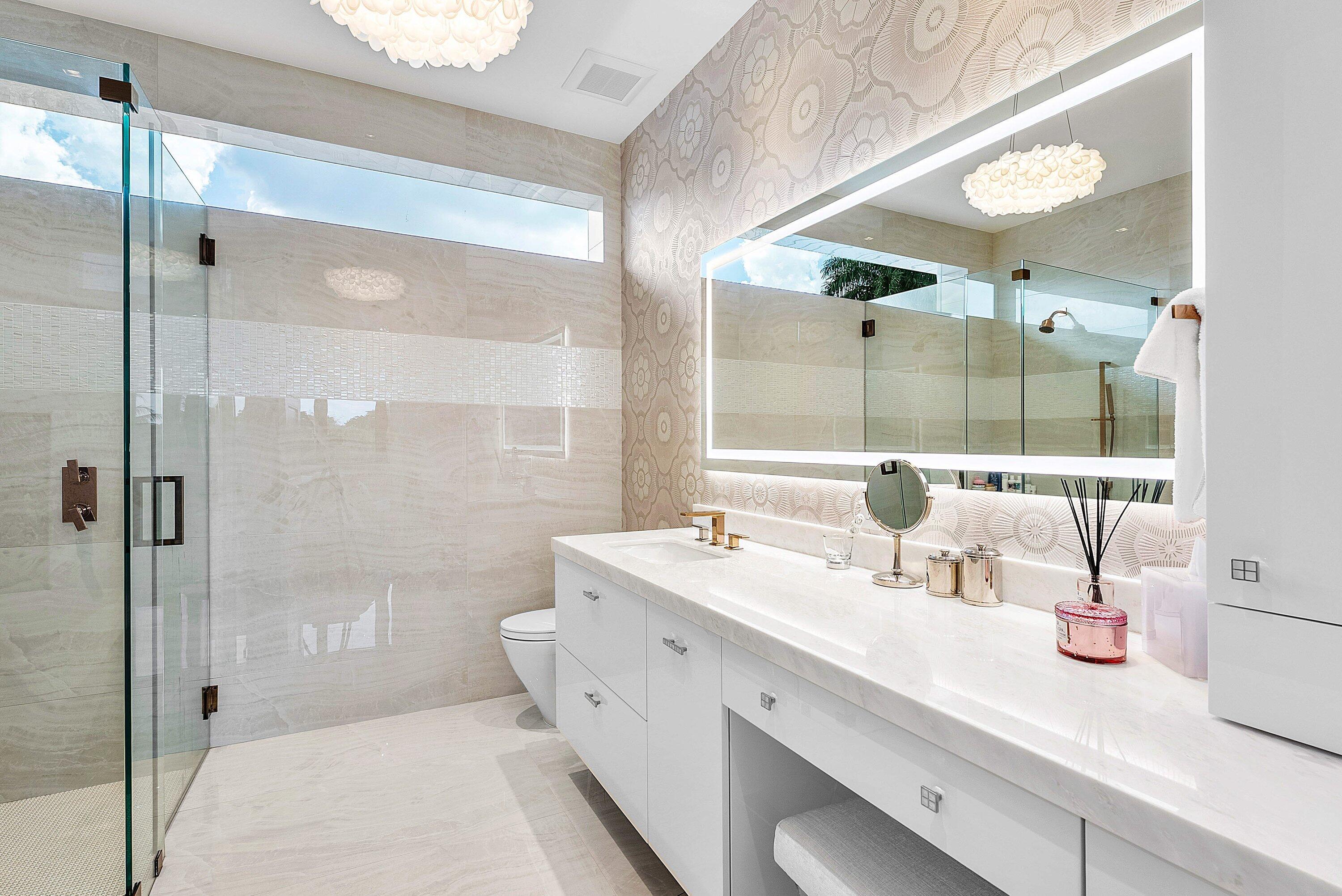 17615 Foxborough Lane Boca Raton, FL 33496 - Photo 41 of 120 a spacious bathroom with a shower sink and mirror