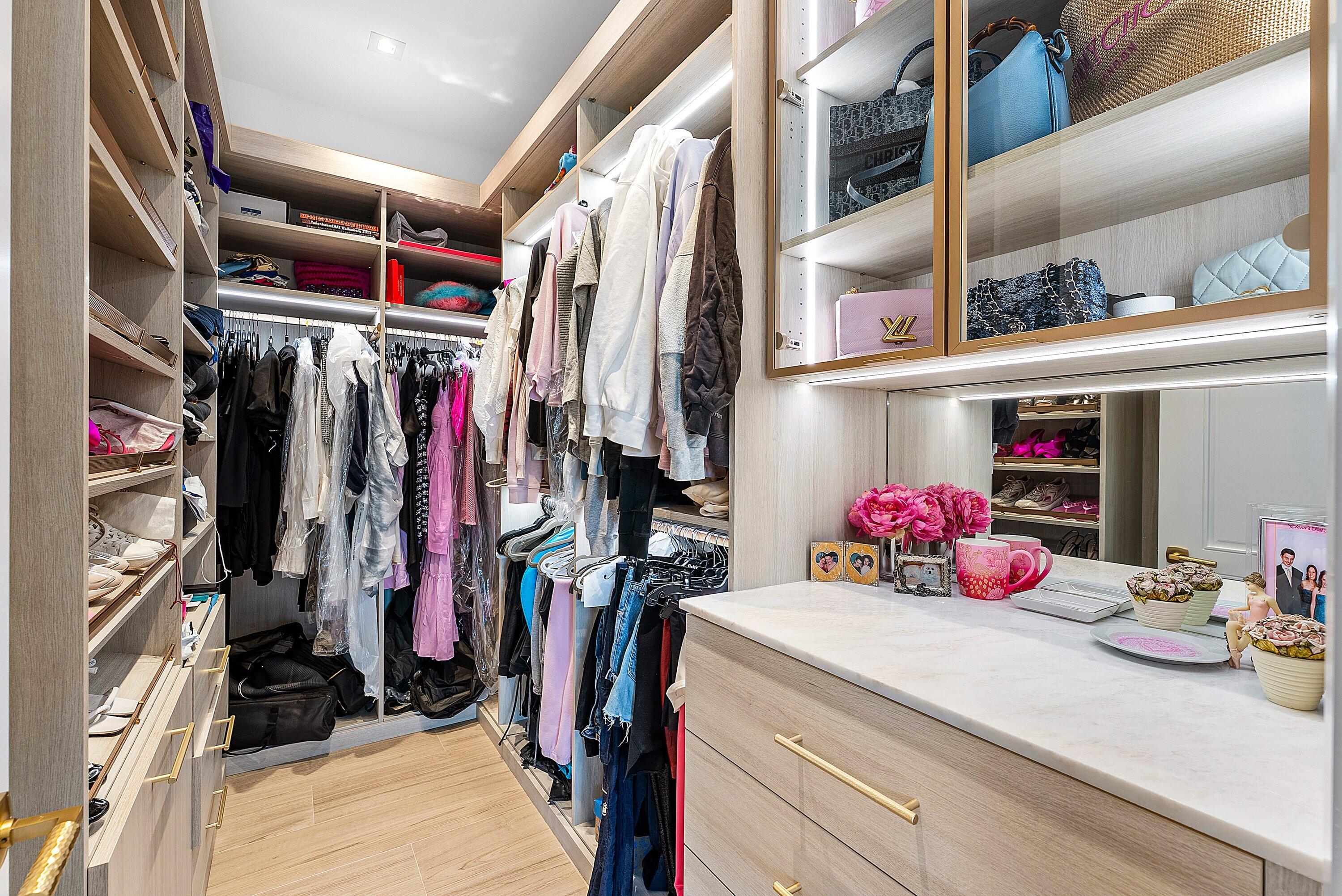 17615 Foxborough Lane Boca Raton, FL 33496 - Photo 43 of 120 a view of walk in closet with clothes and shoes
