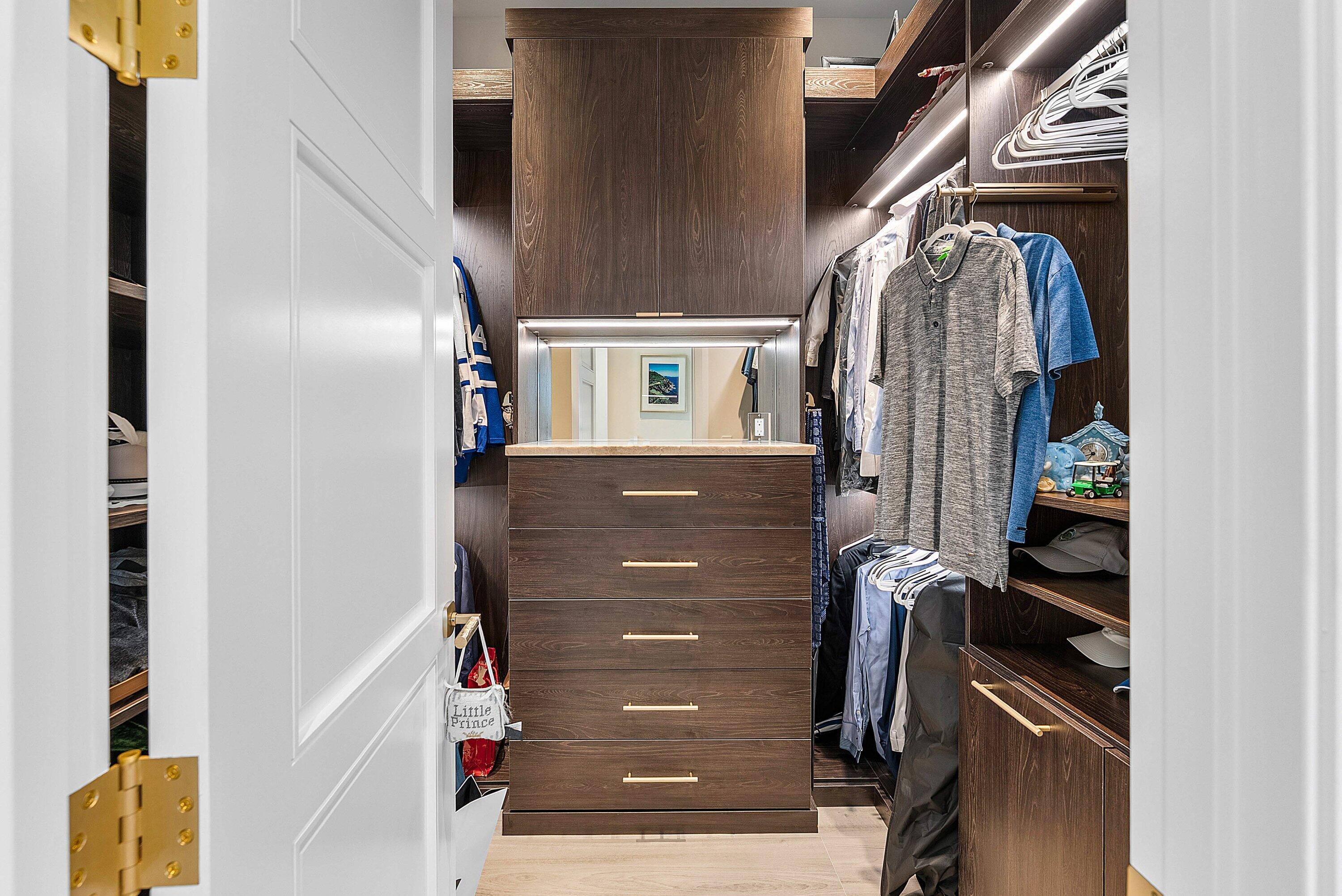17615 Foxborough Lane Boca Raton, FL 33496 - Photo 46 of 120 a view of walk in closet with clothes and shoes