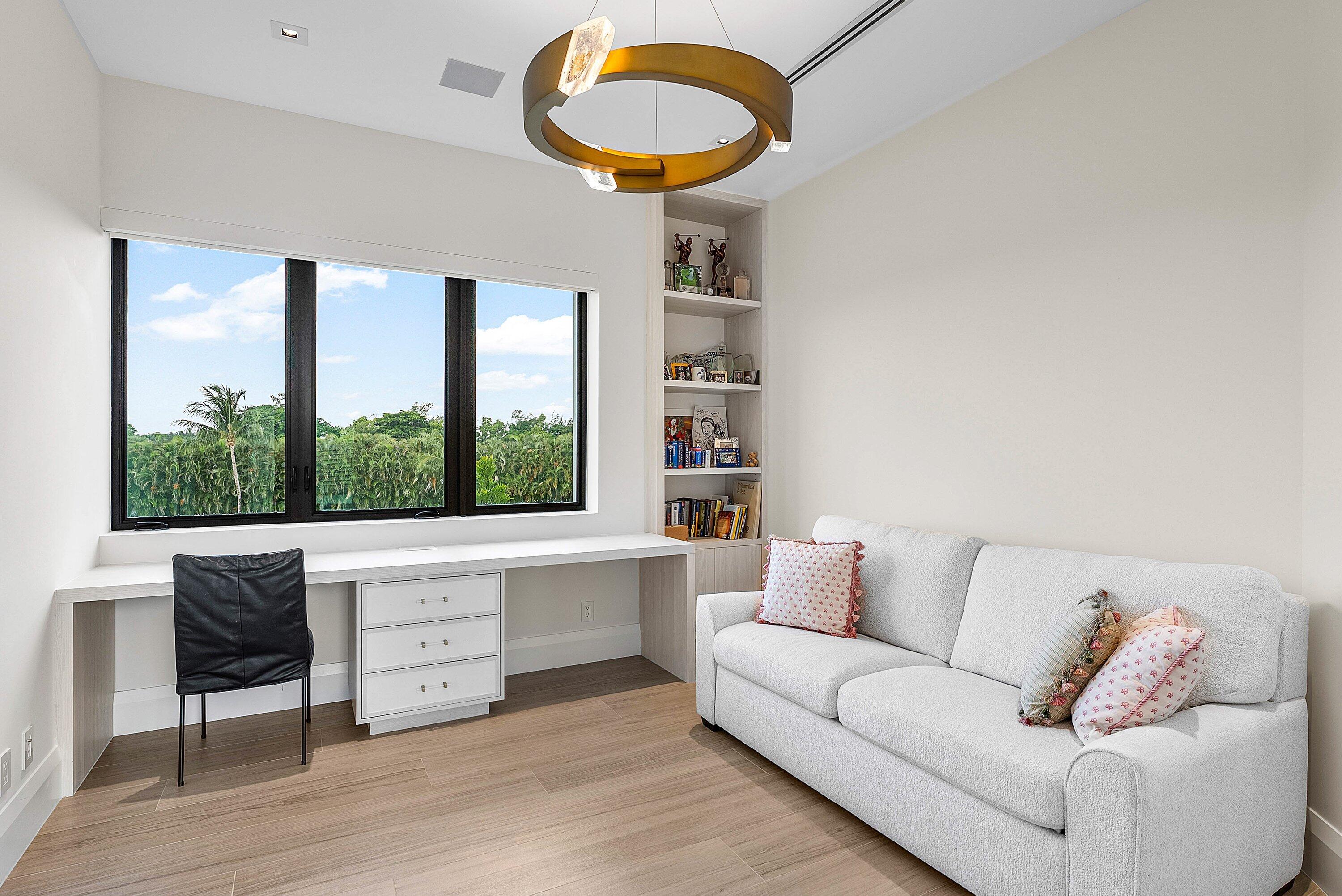 17615 Foxborough Lane Boca Raton, FL 33496 - Photo 47 of 120 a living room with furniture and a floor to ceiling window