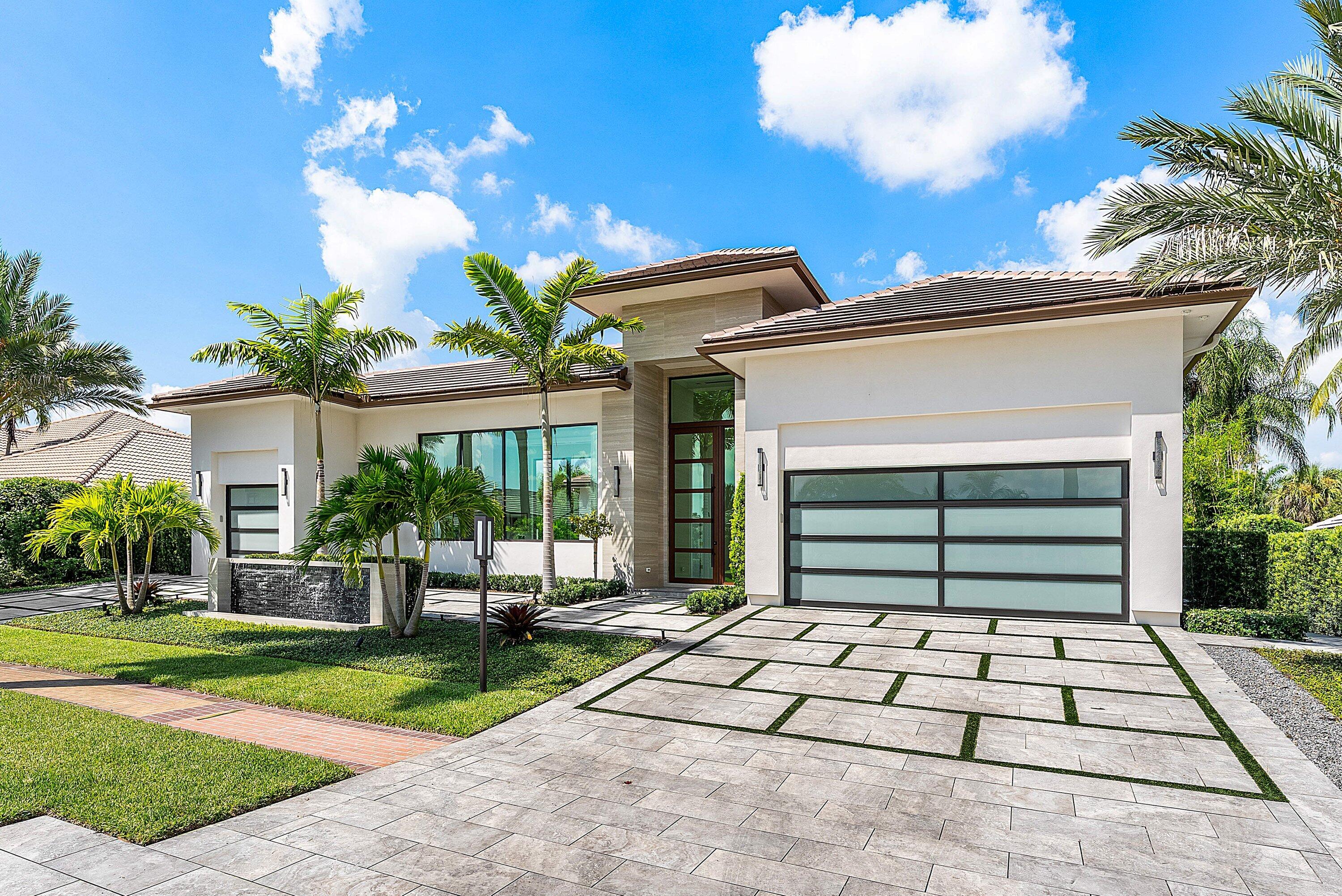17615 Foxborough Lane Boca Raton, FL 33496 - Photo 5 of 120 a front view of a house with a yard