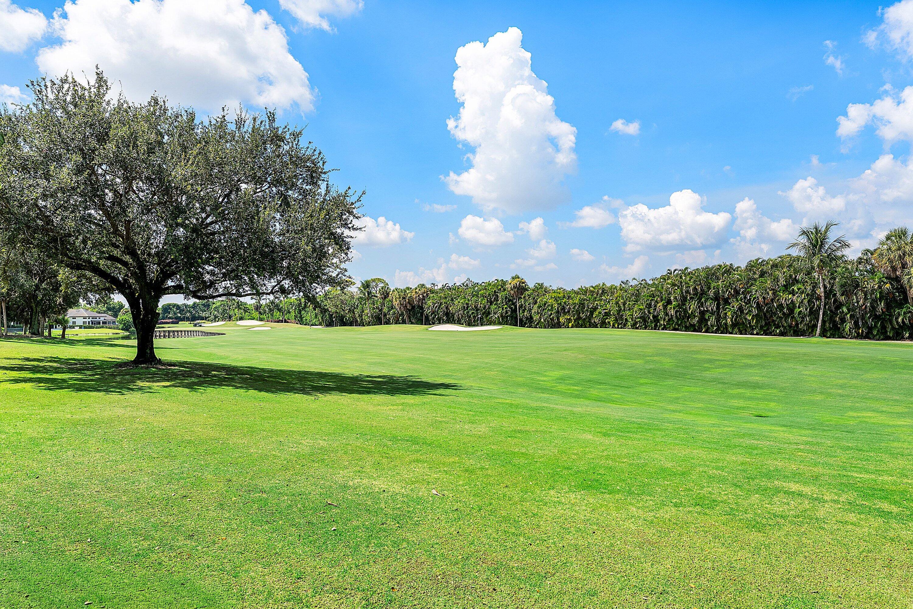 17615 Foxborough Lane Boca Raton, FL 33496 - Photo 57 of 120 a view of a golf course with a lake