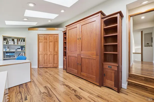 a bedroom with a bed and dresser