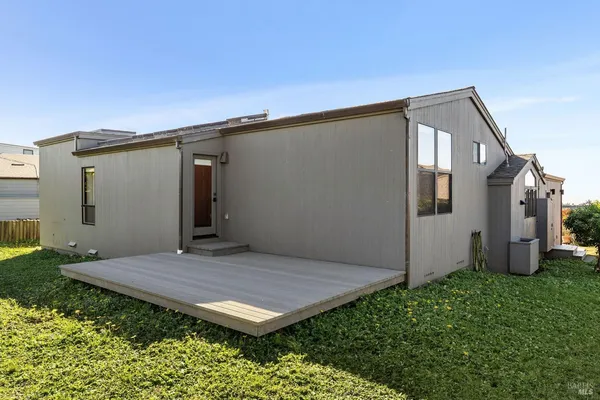 an aerial view of a house with a ocean view