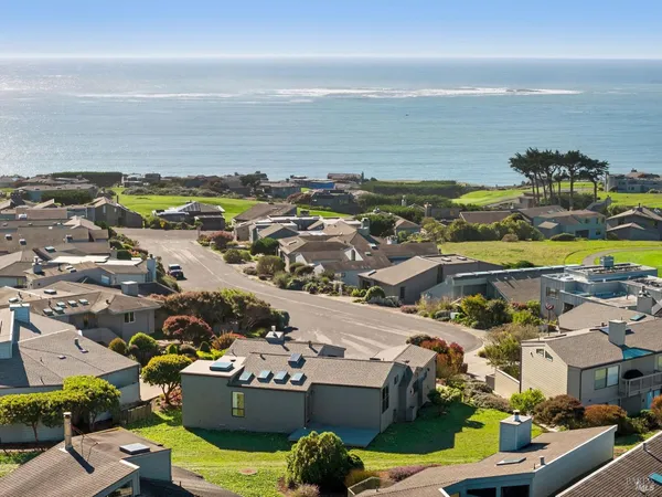 a view of a city with an ocean