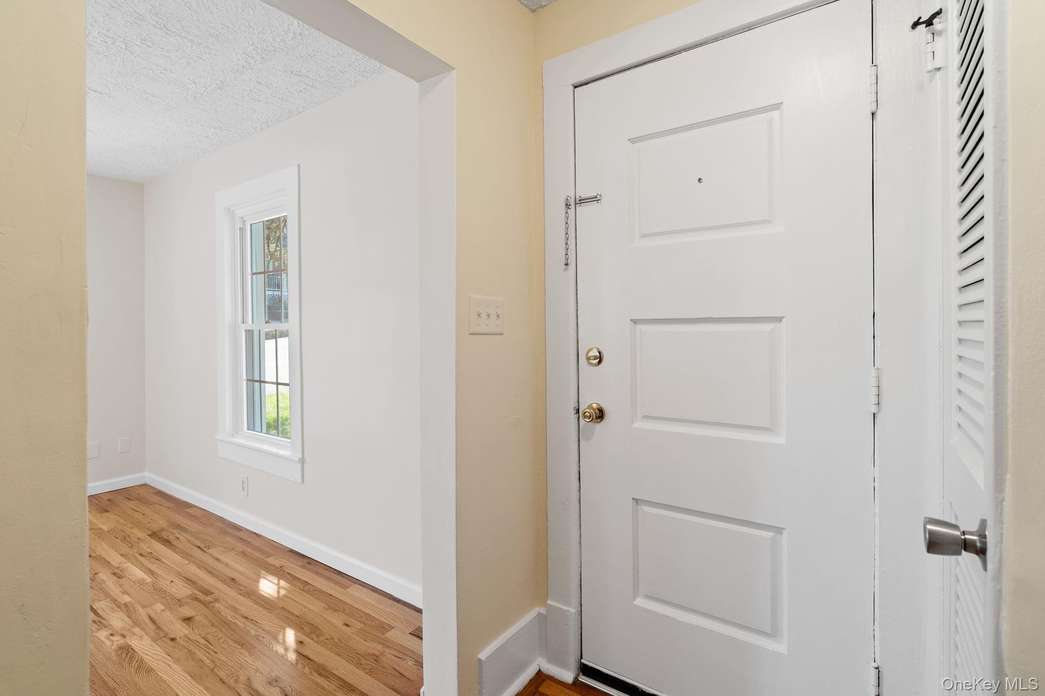 1 2nd Street Walden, NY 12586 - Photo 13 of 42 Foyer entrance featuring light wood-type flooring and a textured ceiling