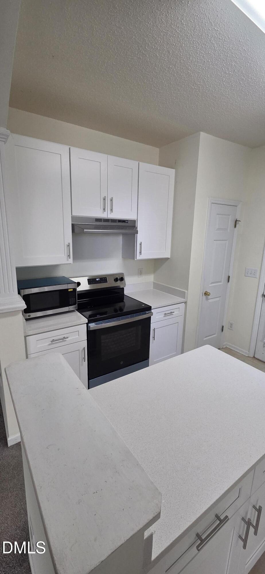 2349 Sapphire Valley Drive Raleigh, NC 27604 - Photo 14 of 46 a kitchen with a sink and white cabinets