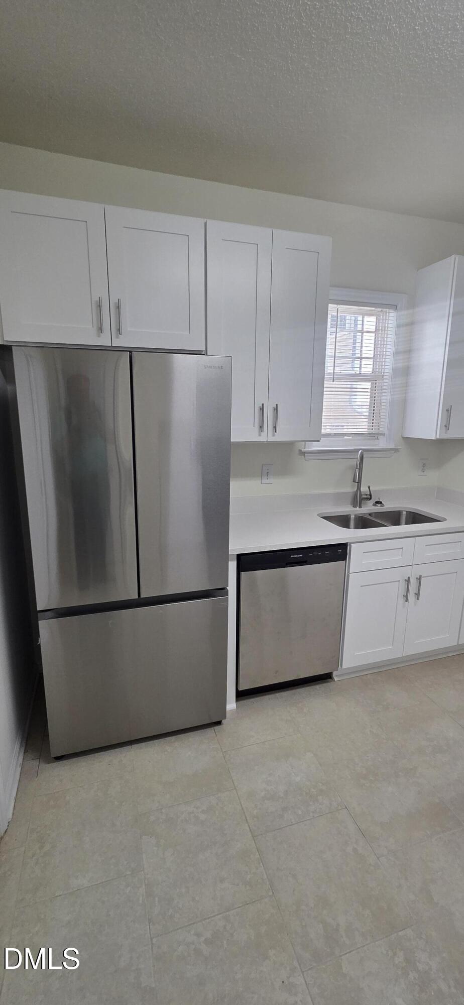 2349 Sapphire Valley Drive Raleigh, NC 27604 - Photo 17 of 46 a white refrigerator freezer sitting in a kitchen