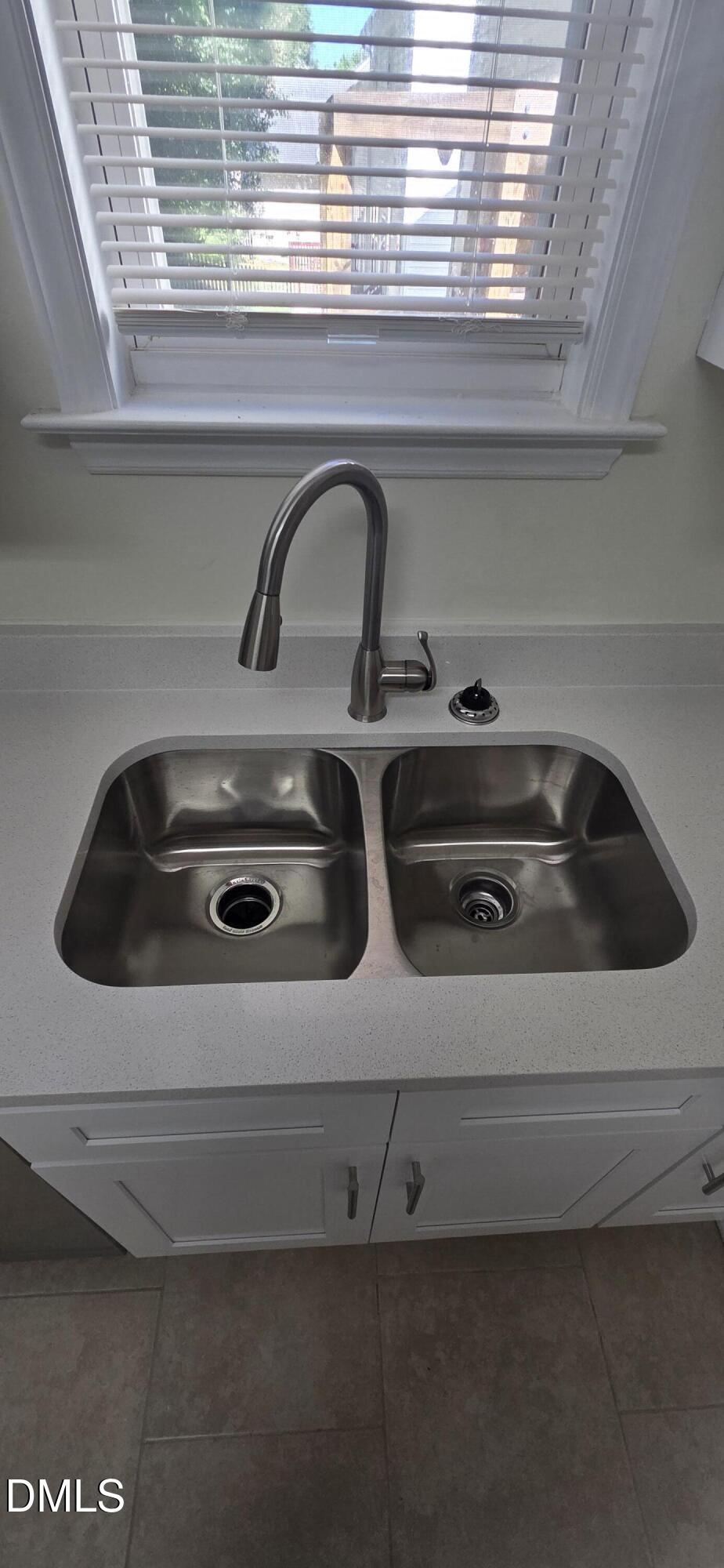 2349 Sapphire Valley Drive Raleigh, NC 27604 - Photo 19 of 46 a close view of sink and kitchen appliances