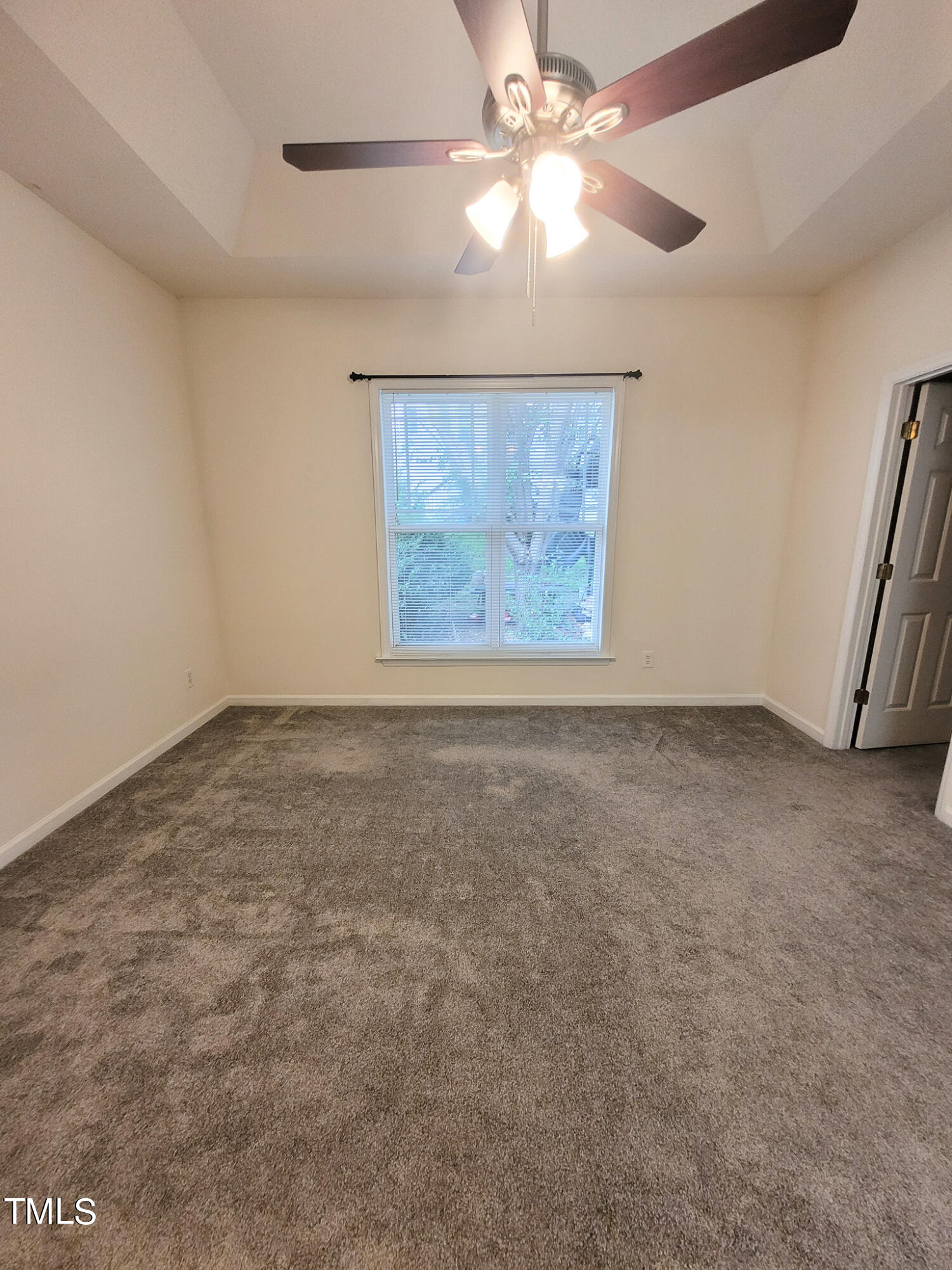 2349 Sapphire Valley Drive Raleigh, NC 27604 - Photo 24 of 46 en empty room with windows and fan