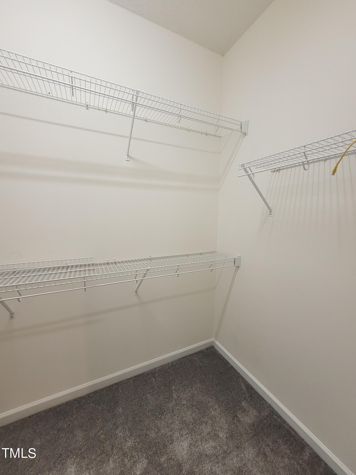 2349 Sapphire Valley Drive Raleigh, NC 27604 - Photo 27 of 46 a view of a room with racks on the wall