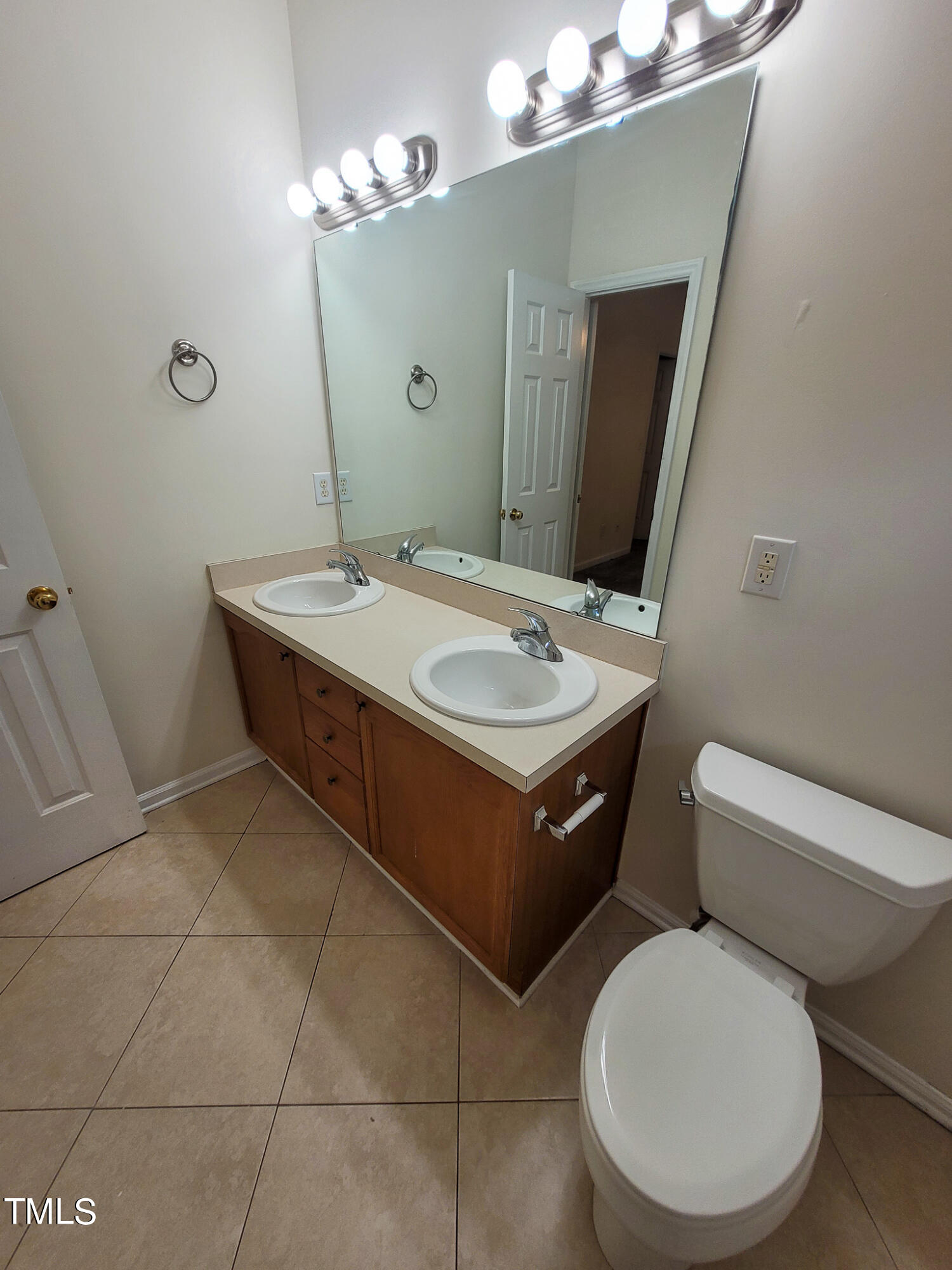 2349 Sapphire Valley Drive Raleigh, NC 27604 - Photo 31 of 46 a bathroom with a toilet sink and mirror