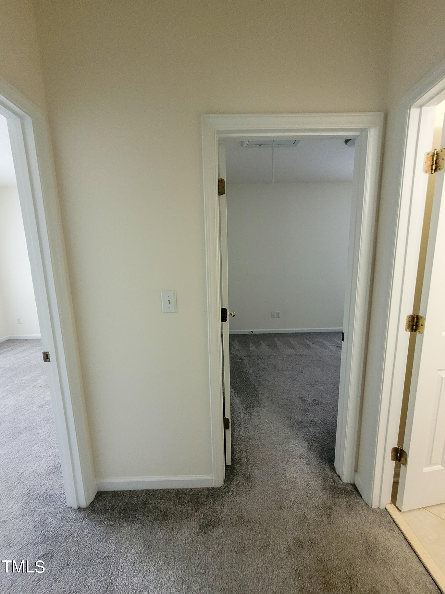 2349 Sapphire Valley Drive Raleigh, NC 27604 - Photo 32 of 46 an empty room with wooden door and a glass door