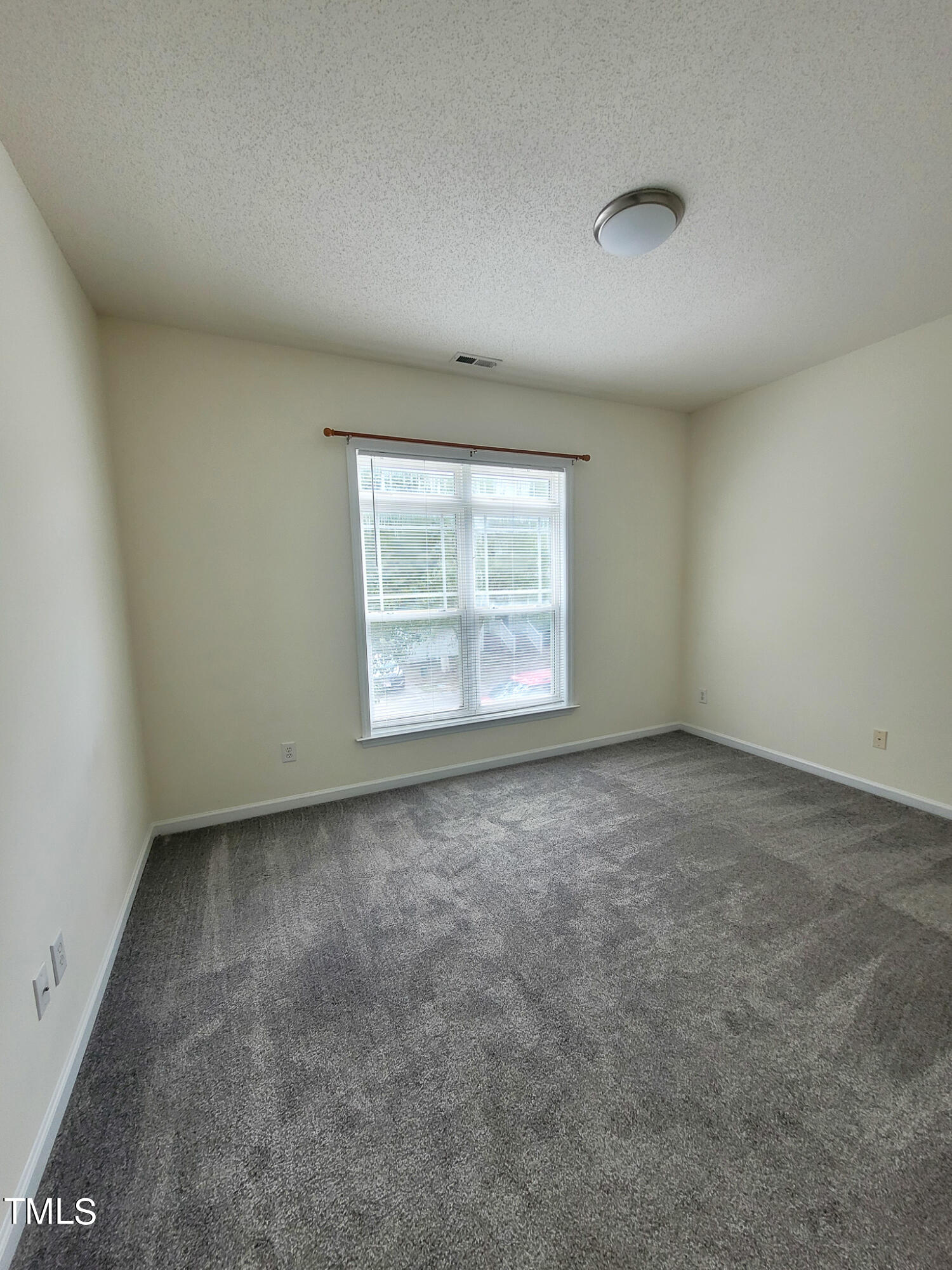 2349 Sapphire Valley Drive Raleigh, NC 27604 - Photo 33 of 46 an empty room with a window