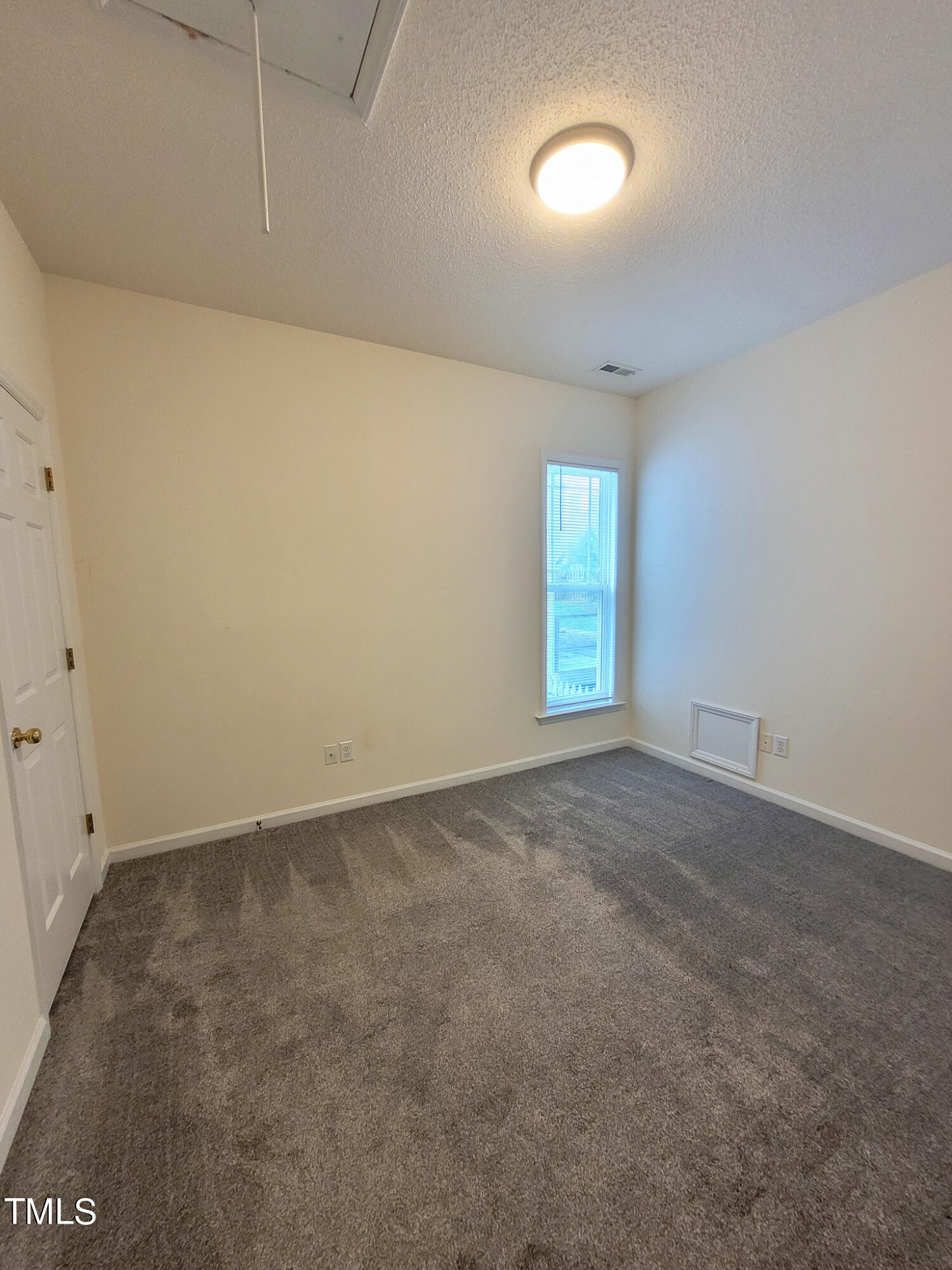 2349 Sapphire Valley Drive Raleigh, NC 27604 - Photo 38 of 46 an empty room with a window
