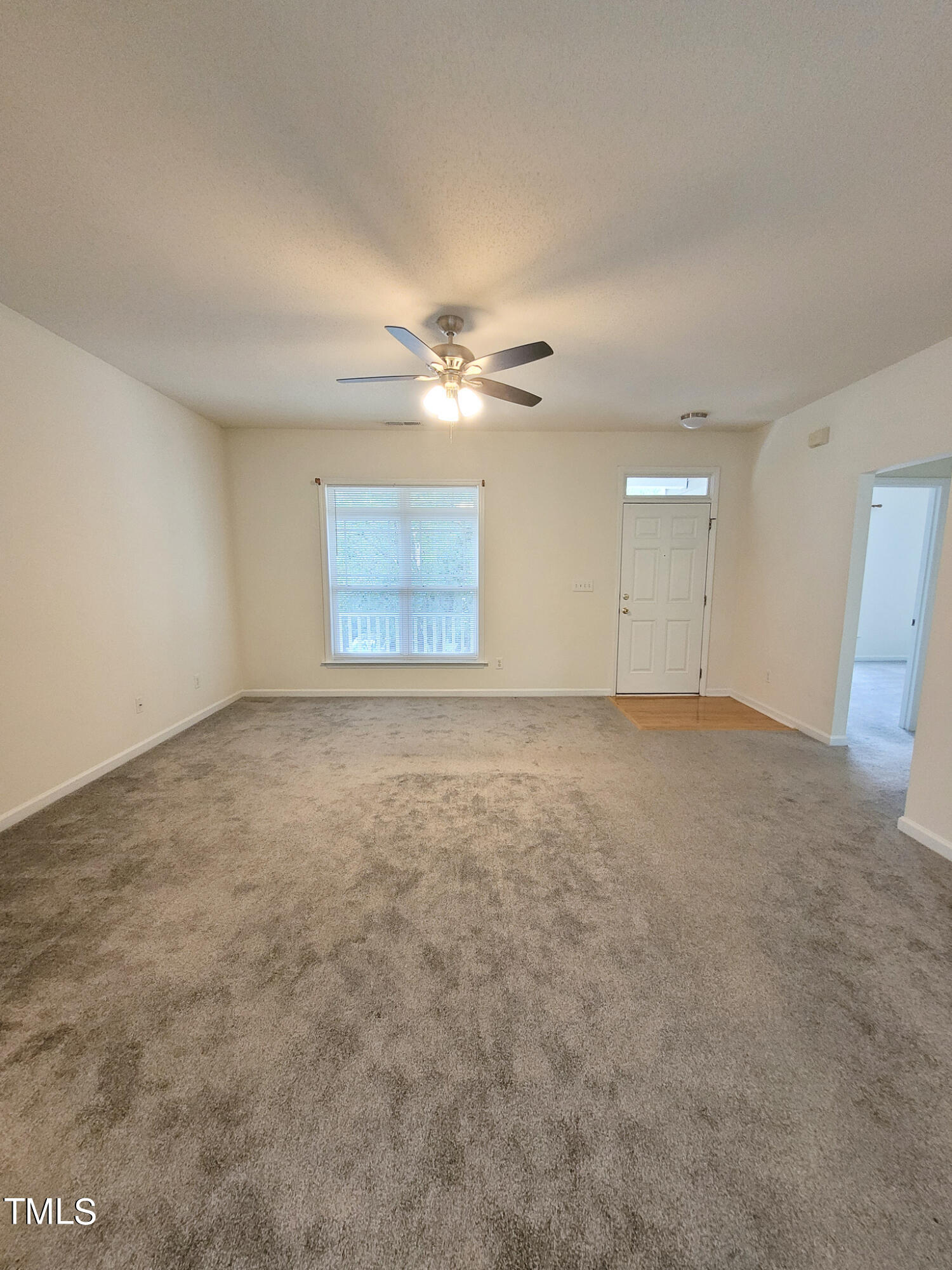 2349 Sapphire Valley Drive Raleigh, NC 27604 - Photo 10 of 46 an empty room with a ceiling fan and window