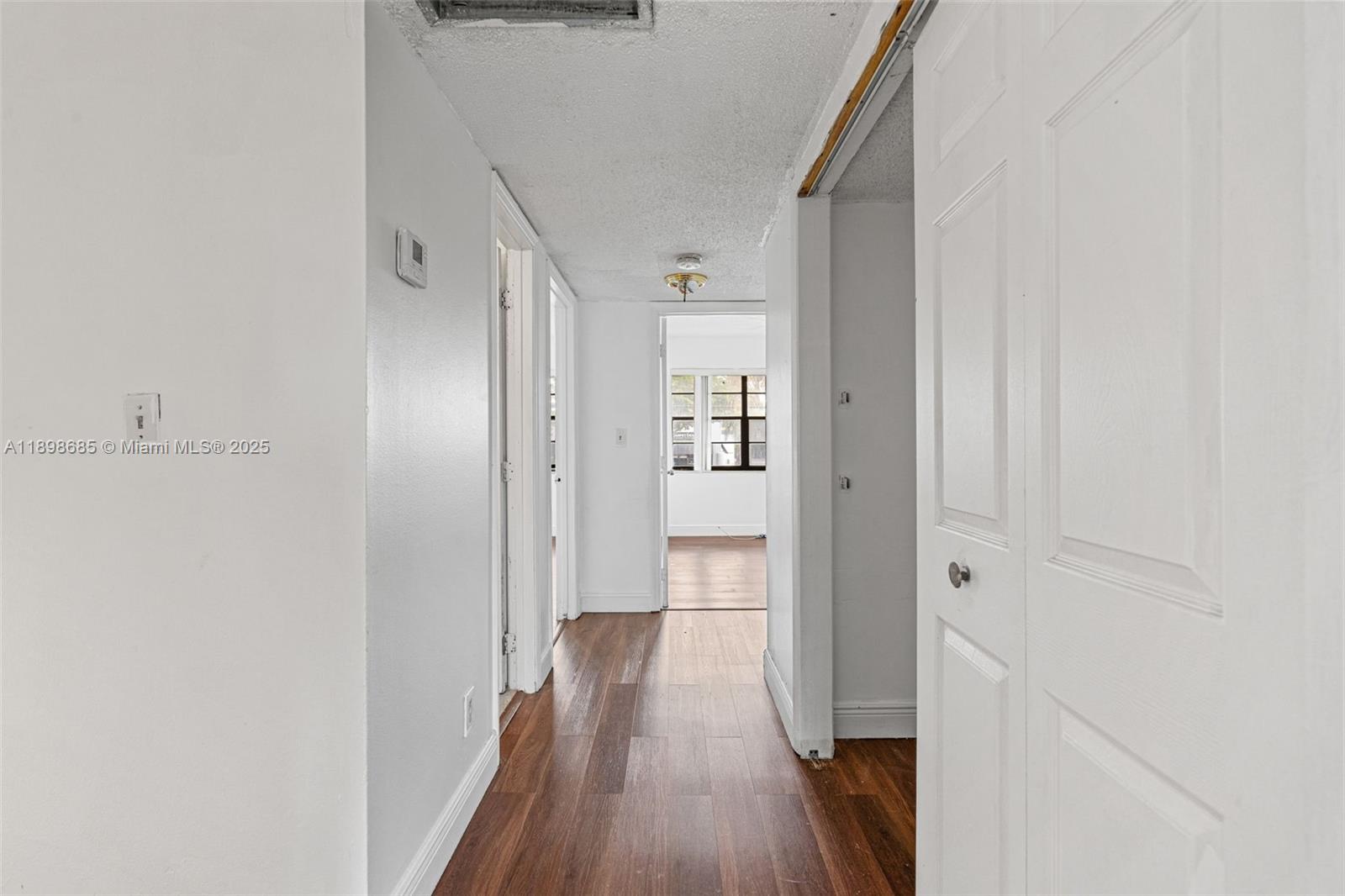 941 Southwest 20th Court Delray Beach, FL 33445 - Photo 16 of 46 a view of a hallway with wooden floor