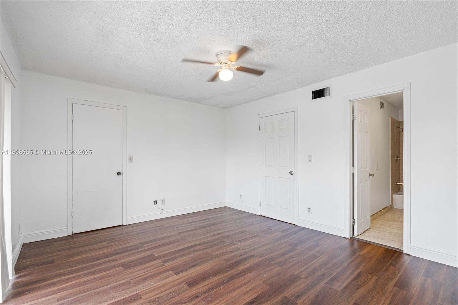 941 Southwest 20th Court Delray Beach, FL 33445 - Photo 19 of 46 a view of empty room with wooden floor